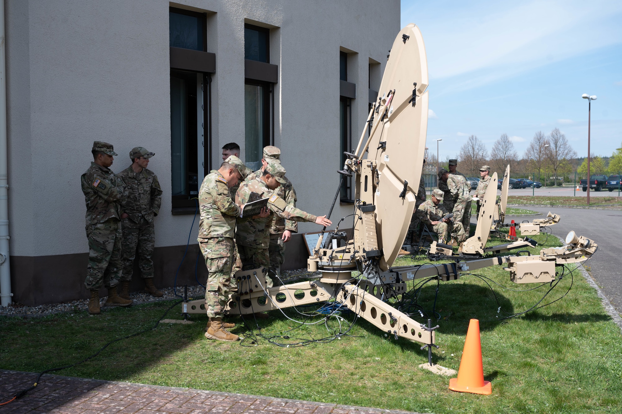 U.S. Army soldiers analyze satellite transmissions.