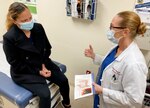 General Surgeon Speaks with Patient