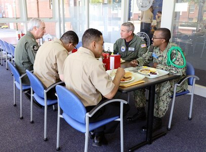 Sailors sitting eating lunch together