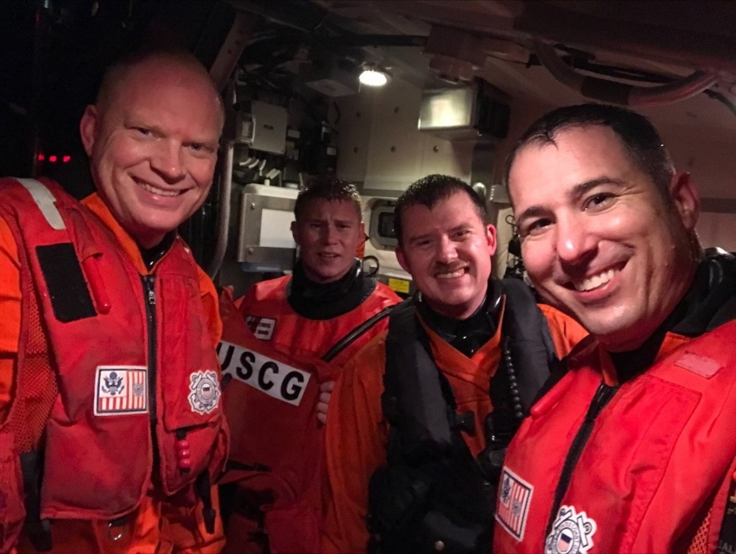 Lt.j.g. Jonathan Orthman (left), Petty Officer Third Class Grant Roberts, Petty Officer Second Class Jimmy Schwader, Lt. Justin Neal together Nov. 1, 2020 following the rescue a fisherman near Meyers Chuck, Alaska. (Courtesy U.S. Coast Guard)