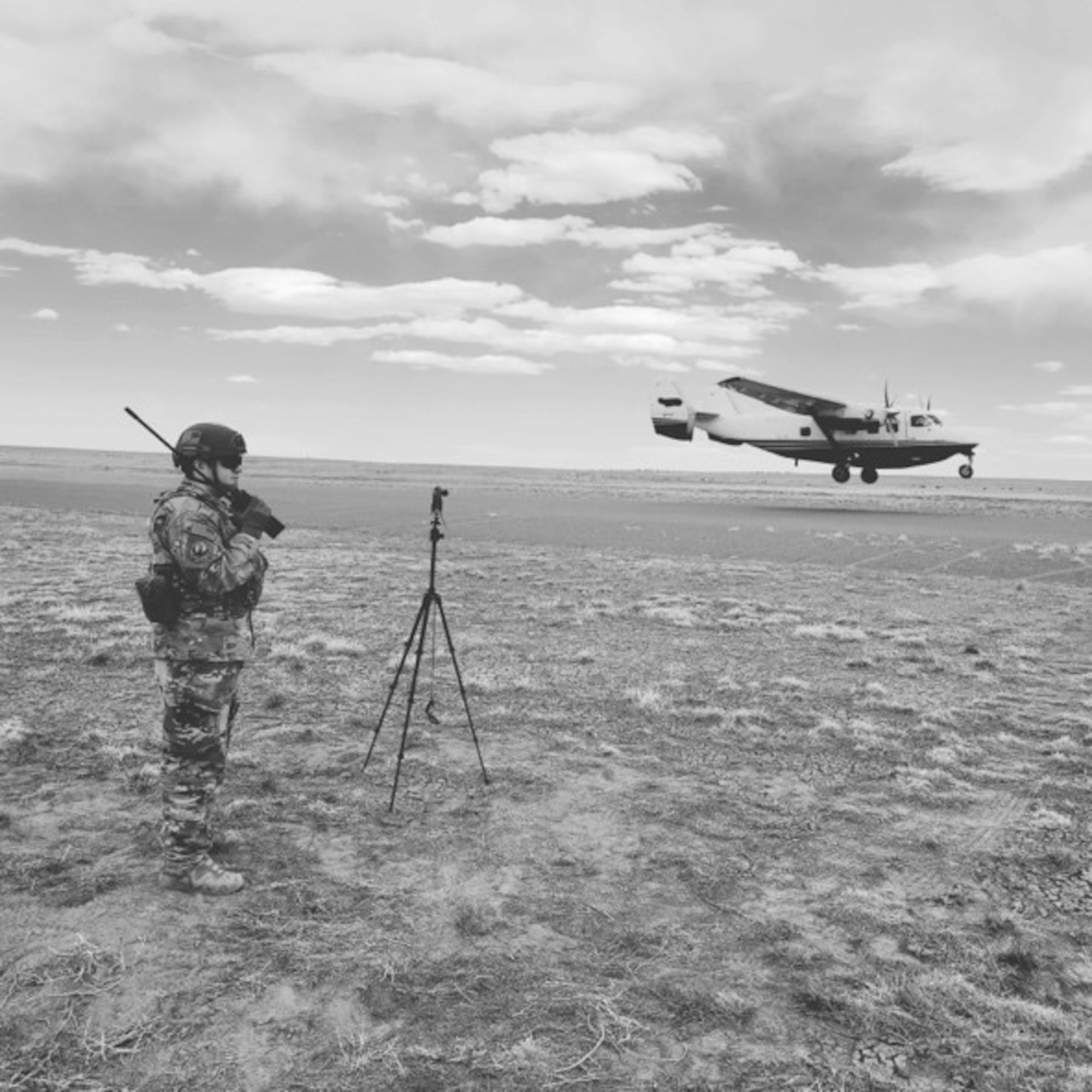 U.S. Air Force Capt. Nicholas Barragan, an Air Mobility Liaison Officer Qualification Course student, uses a radio to control a C-145 Combat Coyote during landing zone operations, at Piñon Canyon Maneuver Site, Colo. Once they complete their training, AMLOs become experienced with calling in landing zone and drop zone operations worldwide. (courtesy photo)