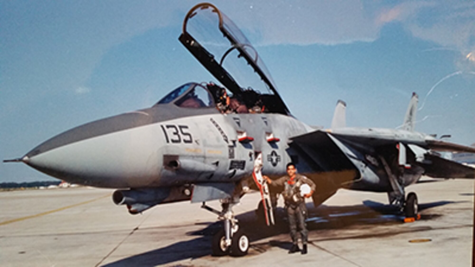 U.S. Navy Lt. Victor Macias poses in front of an F 14 Tomcat at Naval Air Station Oceana, Virginia Beach, Virginia. (Courtesy photography)