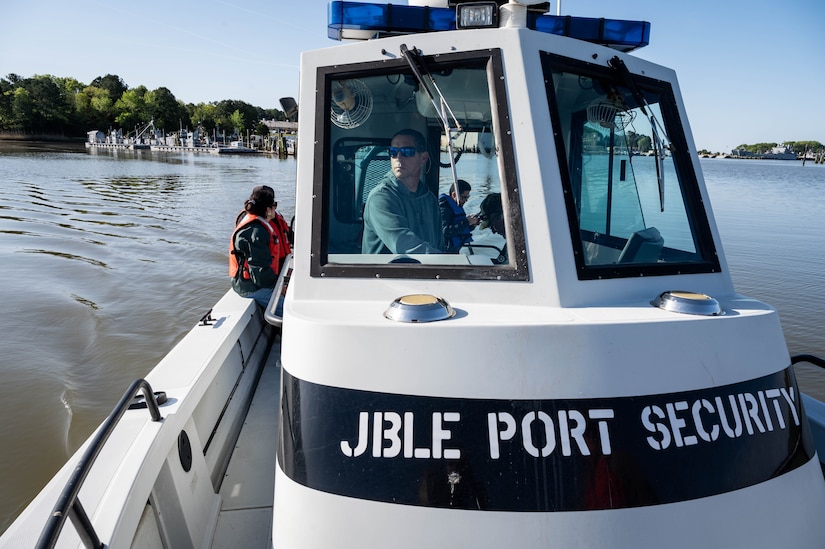 An individual is driving a boat.