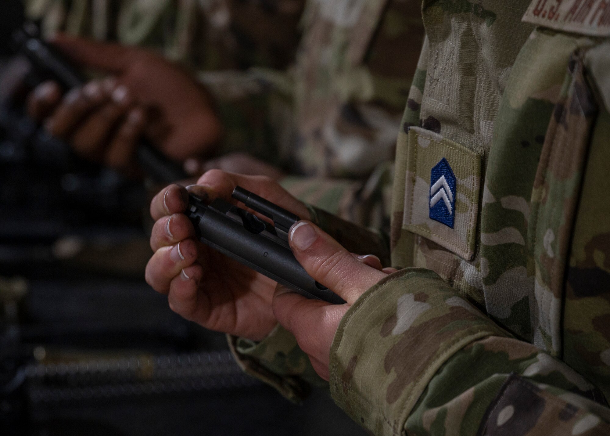Air Force ROTC cadets from North Carolina Agricultural and Technical State University Det. 605, hold M4 Carbine bolt carrier groups during field day training at Seymour Johnson Air Force Base, North Carolina, April 21, 2022.
