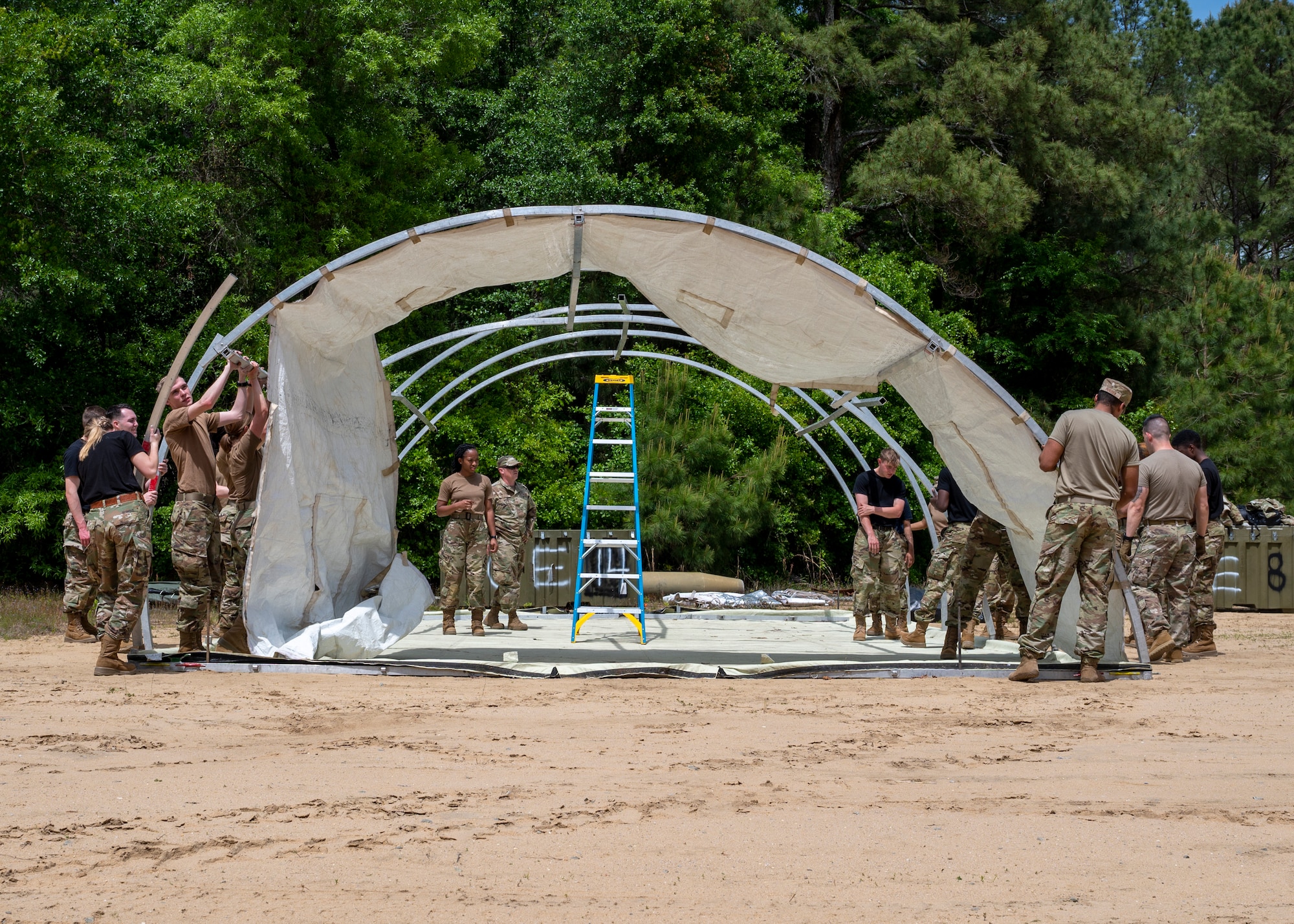 Air Force ROTC cadets from North Carolina Agricultural and Technical State University Det. 605, assemble a small shelter system during field day training at Seymour Johnson Air Force Base, North Carolina, April 21, 2022.
