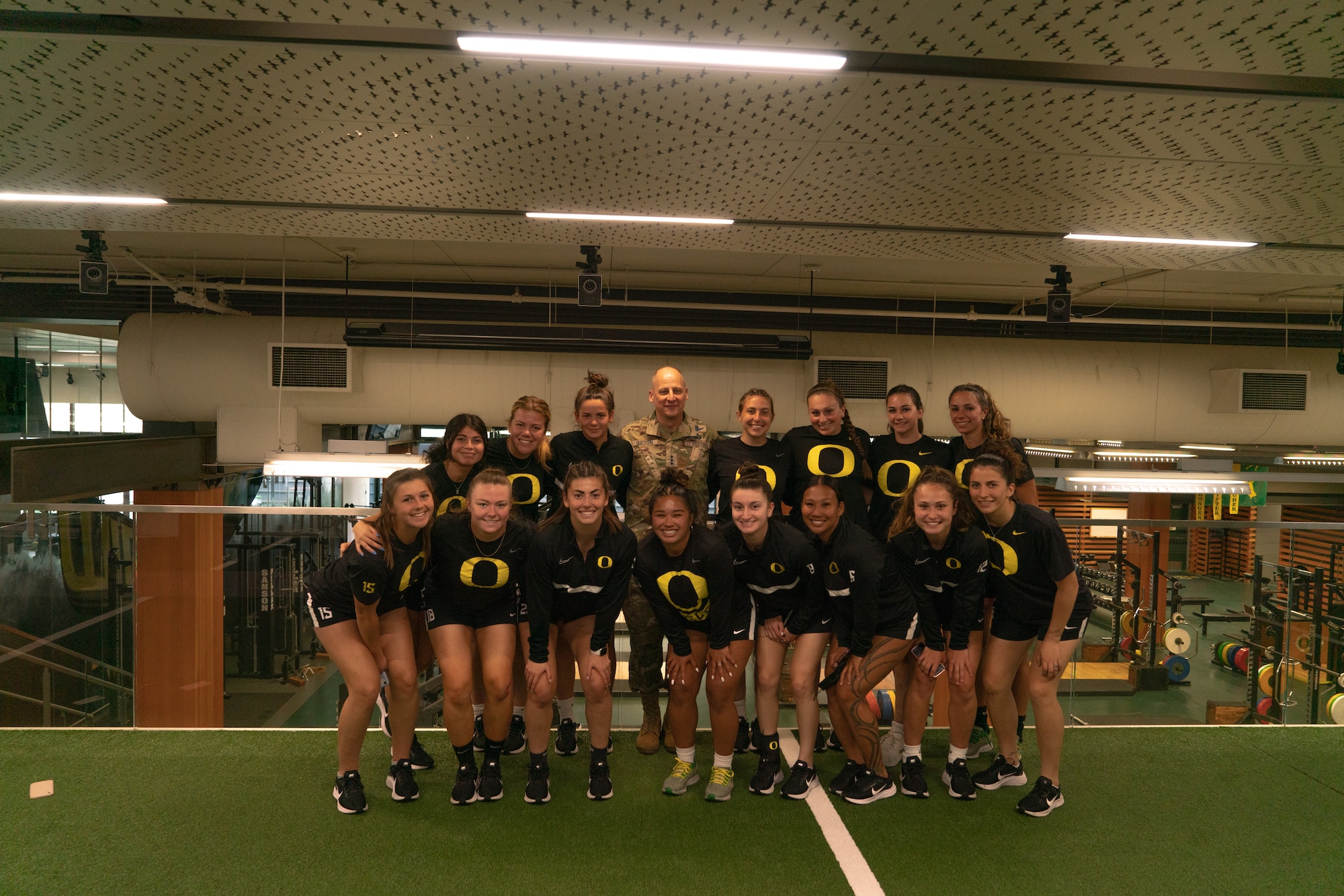 Lt. Gen Michael A. Guetlein joins members of the University of Oregon women’s soccer team during a recent visit to the university where he spoke on leadership.