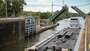 A tow enters the lock chamber moving upstream at Brandon Road Lock and Dam in Joliet, Illinois.