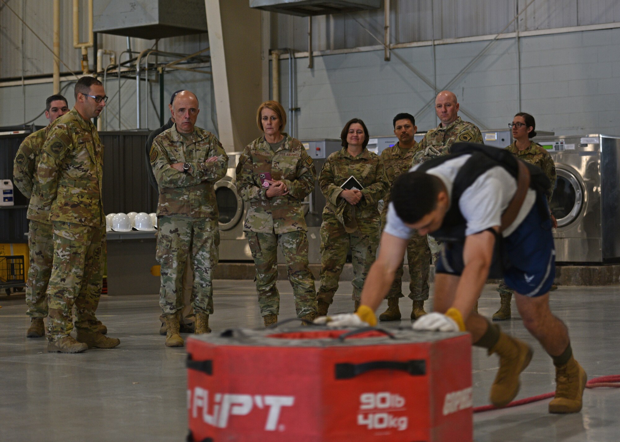 U.S. Air Force Surgeon General Lt. Gen. Robert Miller; Chief Master Sgt. Dawn Kolczynski, Chief, Medical Enlisted Force and Enlisted Corps Chief; and 17th Training Wing members observe an evaluation test at Goodfellow Air Force Base, Texas, April 26, 2022. Members of the 312th Training Squadron discussed how to improve the health and wellness of fire-fighting students with Miller and Kolczynski. (U.S. Air Force photo by Senior Airman Ashley Thrash)
