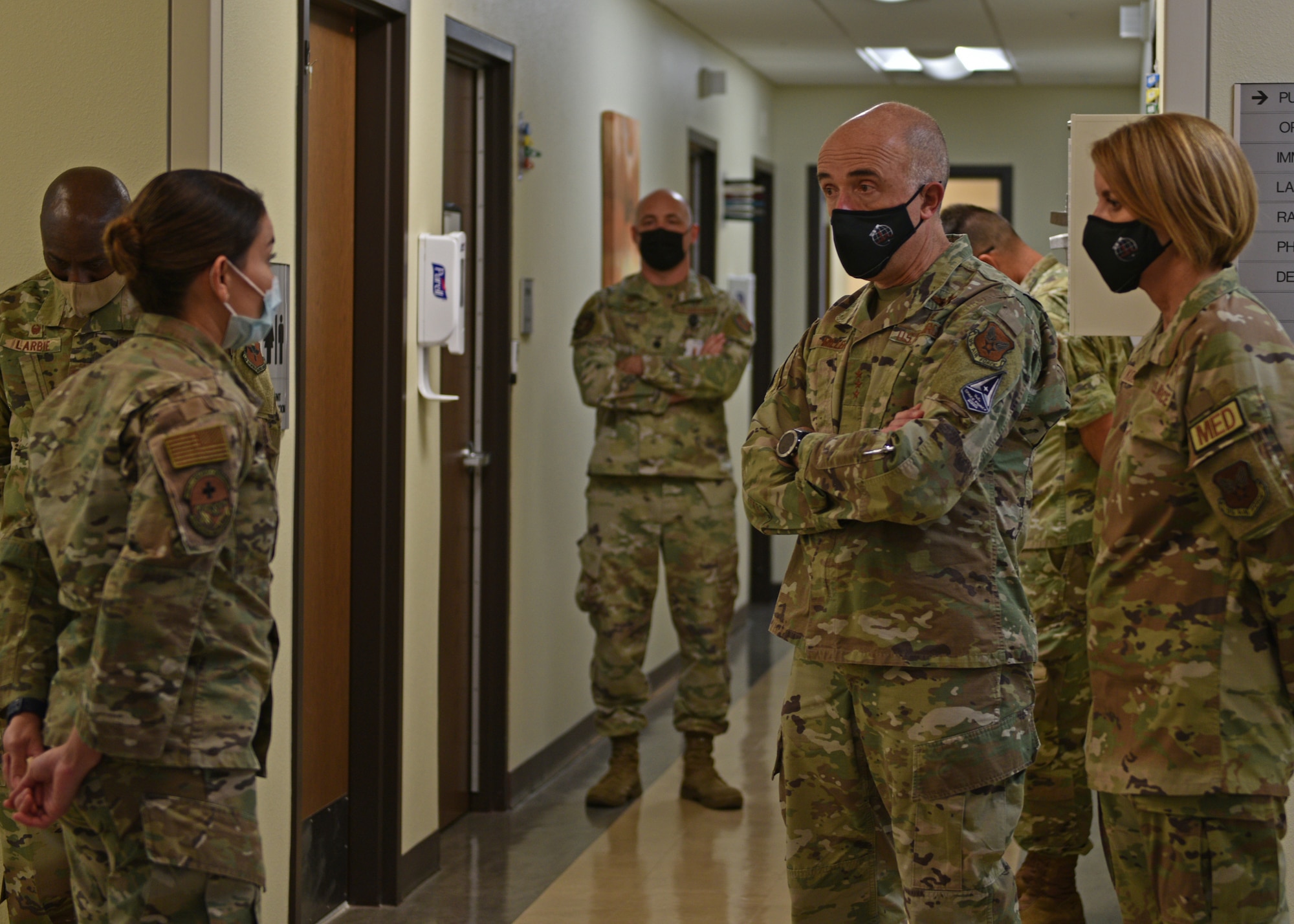 U.S. Air Force Surgeon General Lt. Gen. Robert Miller; Chief Master Sgt. Dawn Kolczynski, Chief, Medical Enlisted Force and Enlisted Corps Chief; and 17th Training Wing members are briefed by Maj. Iveth Galvez-Guzman, 17th Medical Group flight commander of military medicine, at Goodfellow Air Force Base, Texas, April 26, 2022. Galvez-Guzman highlighted the impact that flight medicine has on the base and community members to include dependents and retirees. (U.S. Air Force photo by Senior Airman Ashley Thrash)