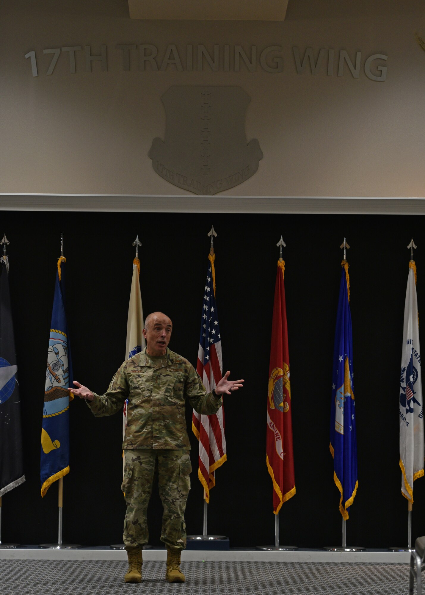 U.S. Air Force Surgeon General Lt. Gen. Robert Miller speaks during an all-call at Goodfellow Air Force Base, Texas, April 26, 2022. Miller held an all-call for 17th Medical Group members and answered questions from Airmen regarding the COVID-19 pandemic, future medical deployments and other topics of interest. (U.S. Air Force photo by Senior Airman Ashley Thrash)