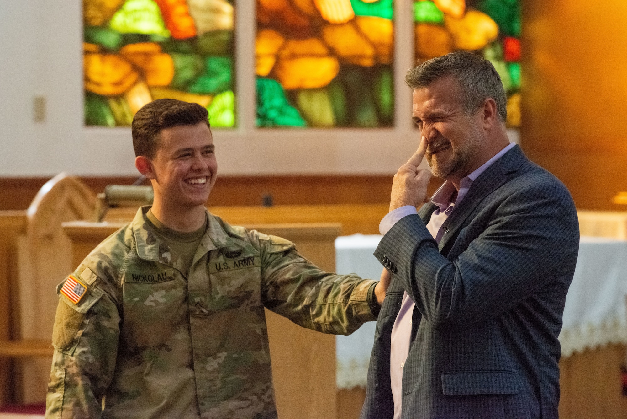A photo of two men speaking