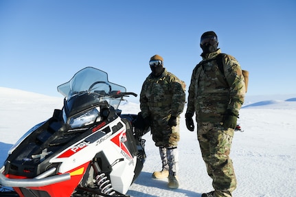 Pvt. Stanley Radeski (right) and Pvt. Benjamin Glenn, service members with the Alaska State Defense Force, survey the outskirts of Nome for a domain awareness exercise, Mar. 1. Alaska Exercise Arctic Eagle-Patriot 2022 increases the National Guard’s capacity to operate in austere, extreme cold-weather environments across Alaska and the Arctic region. AEP22 enhances the ability of military and civilian inter-agency partners to respond to a variety of emergency and homeland security missions across Alaska and the Arctic. (Alaska National Guard photo by Victoria Granado)