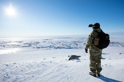 Pvt. Stanley Rodeski, Alaska State Defense Force, surveys the outskirts of Nome for a domain awareness exercise, Mar. 1. Alaska Exercise Arctic Eagle-Patriot 2022 increases the National Guard’s capacity to operate in austere, extreme cold-weather environments across Alaska and the Arctic region. AEP22 enhances the ability of military and civilian inter-agency partners to respond to a variety of emergency and homeland security missions across Alaska and the Arctic. (Alaska National Guard photo by Victoria Granado)