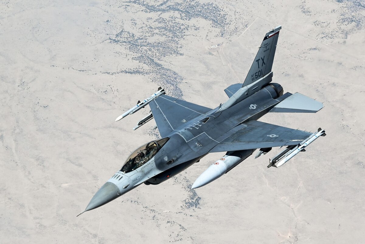 An F-16 Fighting Falcon from the 301st Fighter Wing's 457th Fighter Squadron, Naval Air Station Joint Reserve Base Fort Worth, Texas, prepares to refuel with a KC-135 from the 465th Air Refueling Squadron, Tinker Air Force Base, Okla. Two F-16s had recently participated in a funeral flyover honoring Lt. Col. (ret.) Bill Gauntt, RF-4C Phantom II pilot and Vietnam War POW. (U.S. Air Force photo by 2nd Lt. Mary Begy)