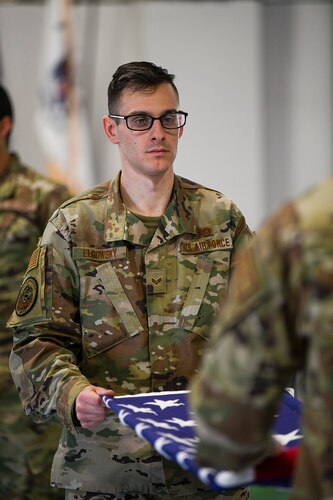 Senior Airman Steven Elgowsky, 445th Civil Engineer Squadron engineering aide and member of the Wright-Patterson Air Force Base Honor Guard, practices folding a flag during ceremonial guardsman training March 16. (U.S. Air Force photo by Master Sgt. Patrick O’Reilly)