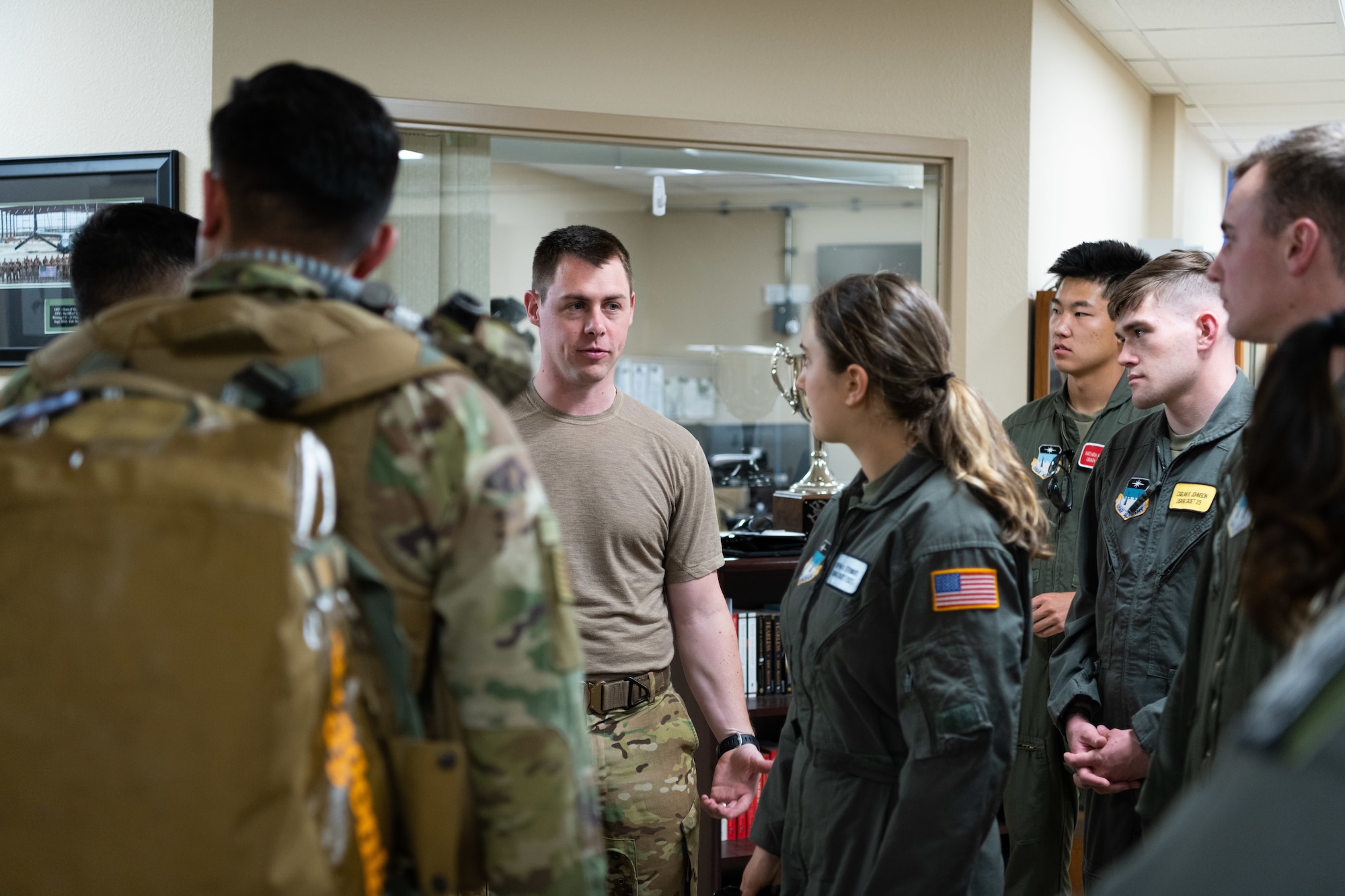 Airmen stand in a circle