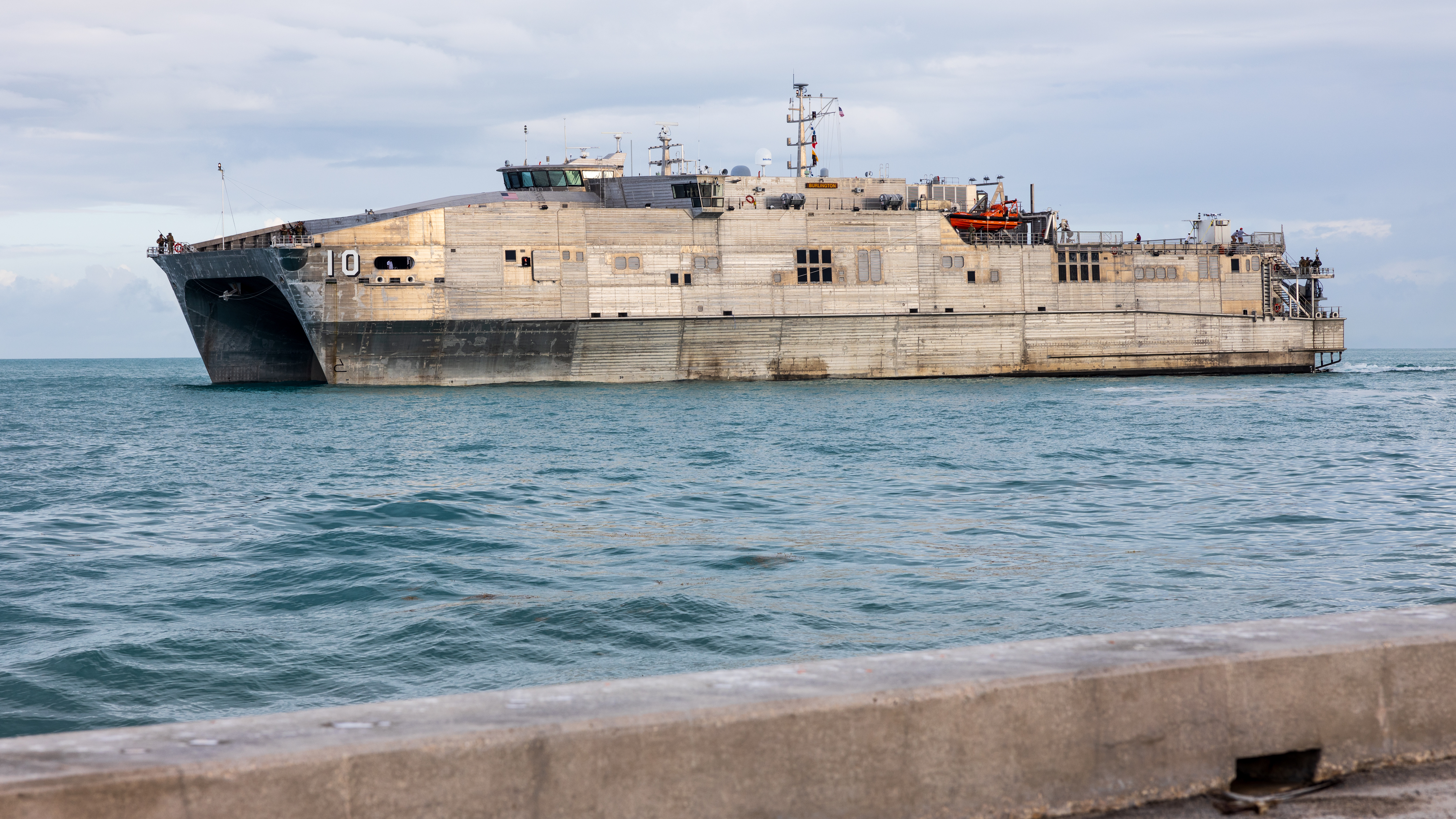 The expeditionary fast transport vessel USNS Burlington (T-EPF-10) departs the pier during a fleet experimentation period with scientists from various research and development agencies and U.S. Naval Forces Southern Command/U.S. 4th Fleet.