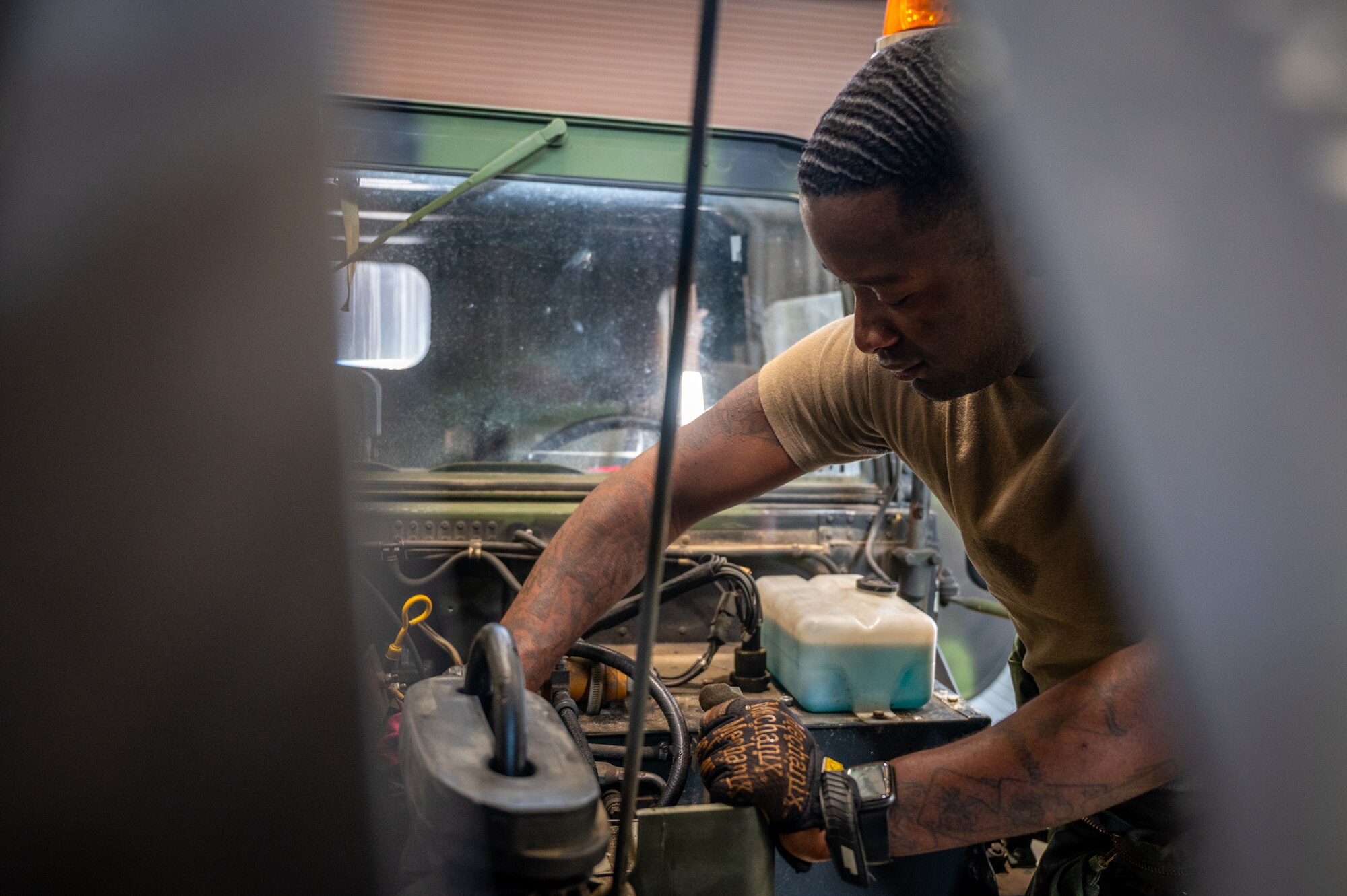 U.S. Army Specialist Darius Sims, 35th Air Defense Artillery Brigade all-wheel mechanic, finishes up routine maintenance on a high mobility multipurpose wheeled vehicle (HMMWV) at Osan Air Base, Republic of Korea, April 29, 2022.