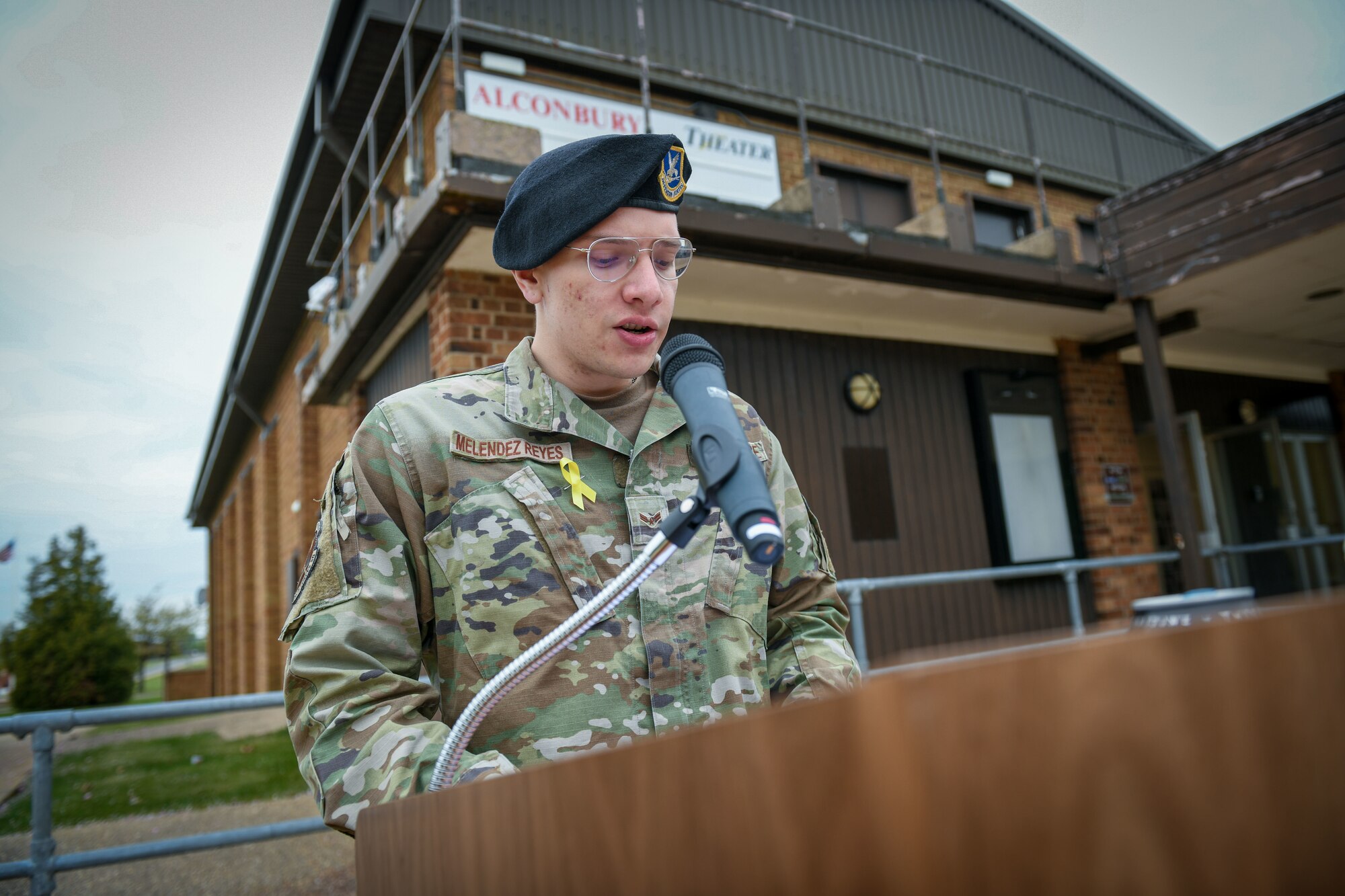 Airman at a podium.