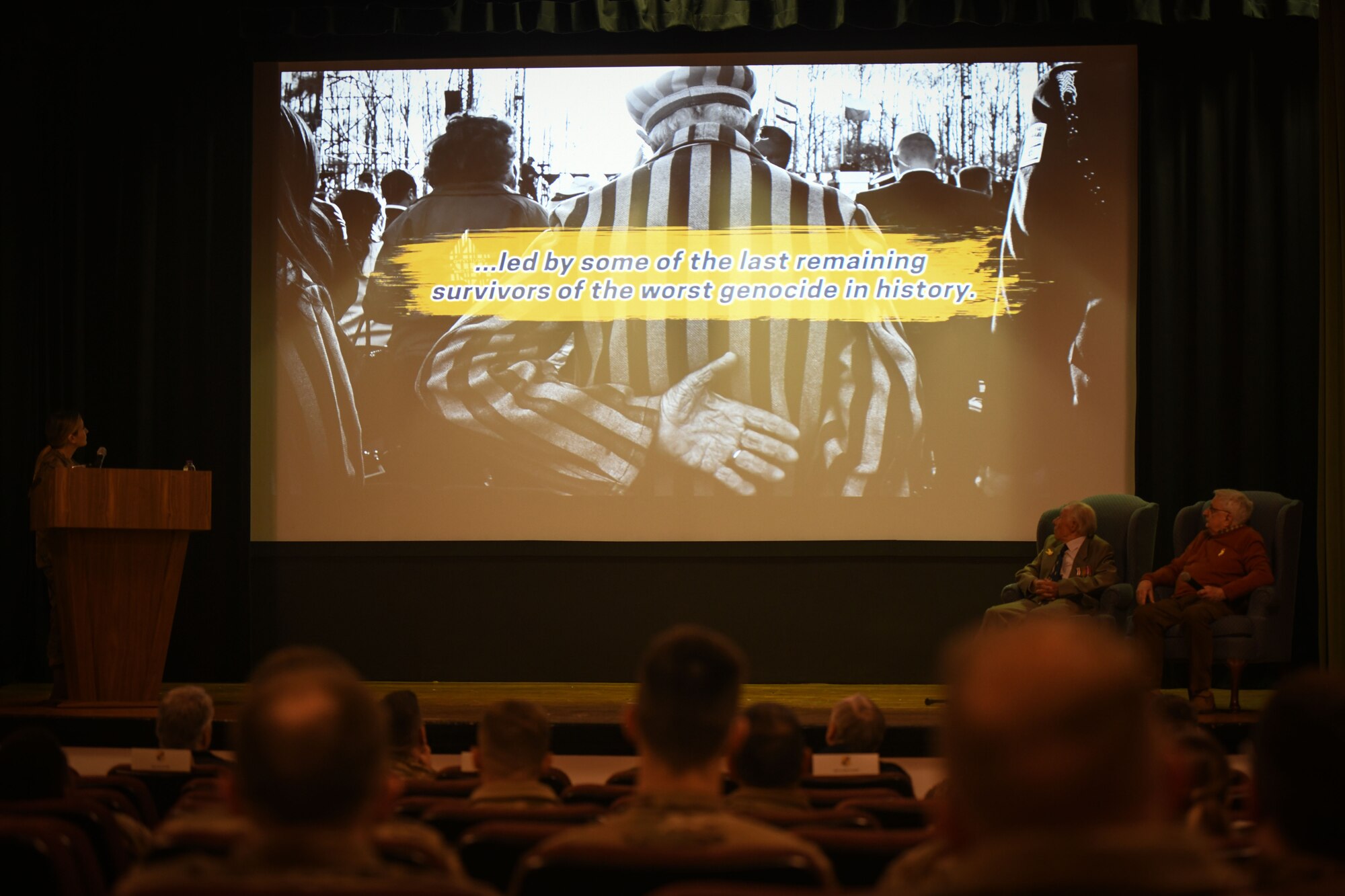 Airmen watch a video.