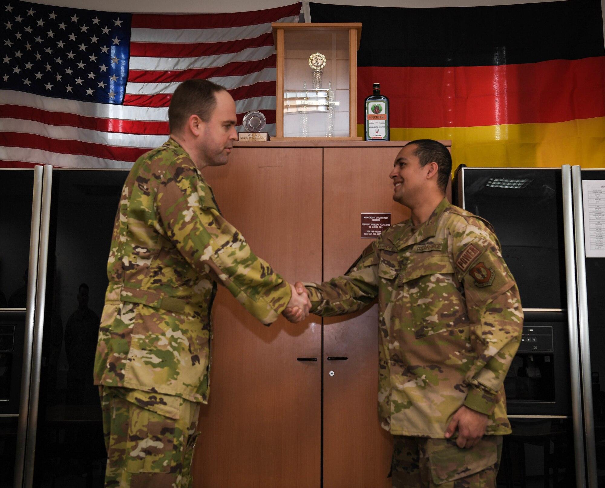 Uniformed U.S. Air Force Airmen shake hands