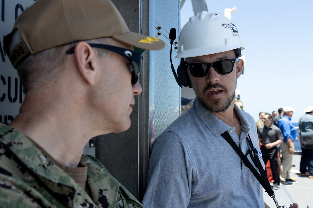 A scientist working with Naval Warfare Centers discusses future operating concepts with a Navy Capt. Chip Wrye, the maritime operations center director, U.S. 4th Fleet, aboard the expeditionary fast transport vessel USNS Burlington (T-EPF-10) during a fleet experimentation period with scientists working with the Office of Naval Research and U.S. Naval Forces Southern Command/U.S. 4th Fleet. The fleet experimentation serves to demonstrate Navy/Marine Corps integration by testing concepts that would be employed during expeditionary advance base operations, evaluating expeditionary systems for force protection and coordinated electronic warfare.