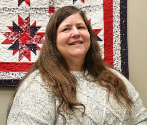 Karen Williams, Chief of the Project Support Section, sits for a photo in her office at the Mobile District in Mobile, Ala. on April 22, 2022. Williams is retiring from USACE and the Mobile District after 42 years of service. (USACE photo by Chuck Walker)