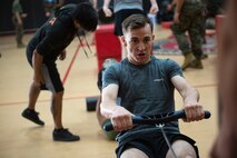 U.S. Marine Corps, Cpl. Holden L. Mesimer, a Marine Air Ground Task Force Planner with Plans Policies and Operations South, pulls a rowing machine at the Hopkins Hall Gymnasium, Virginia, April 29, 2022. Marines graduating from the High Intensity Tactical Training (HITT) program arranged an exercise to demonstrate their new mastery of instruction. The HITT Program is a comprehensive combat-specific strength and conditioning program that is essential to a Marine’s physical development, combat readiness, and resiliency. (U.S. Marine Corps photo by Lance Cpl. Jack Chen)