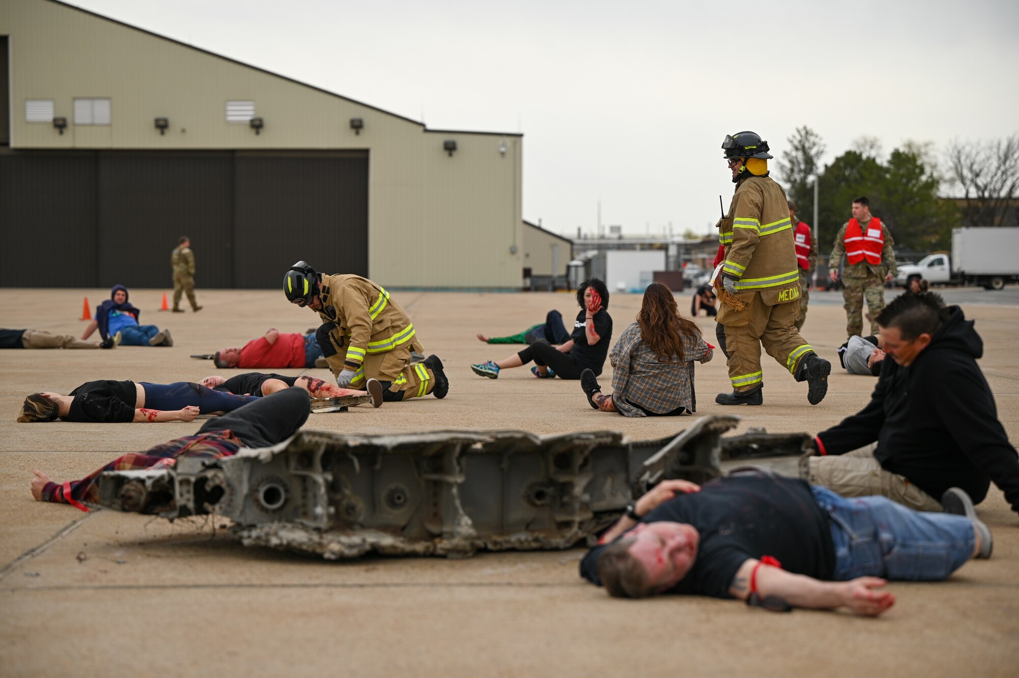 Firefighters with the 775th Fire & Emergency Services Flight assess simulated wounded during a crash exercise at Hill Air Force Base, Utah, April 27, 2022.