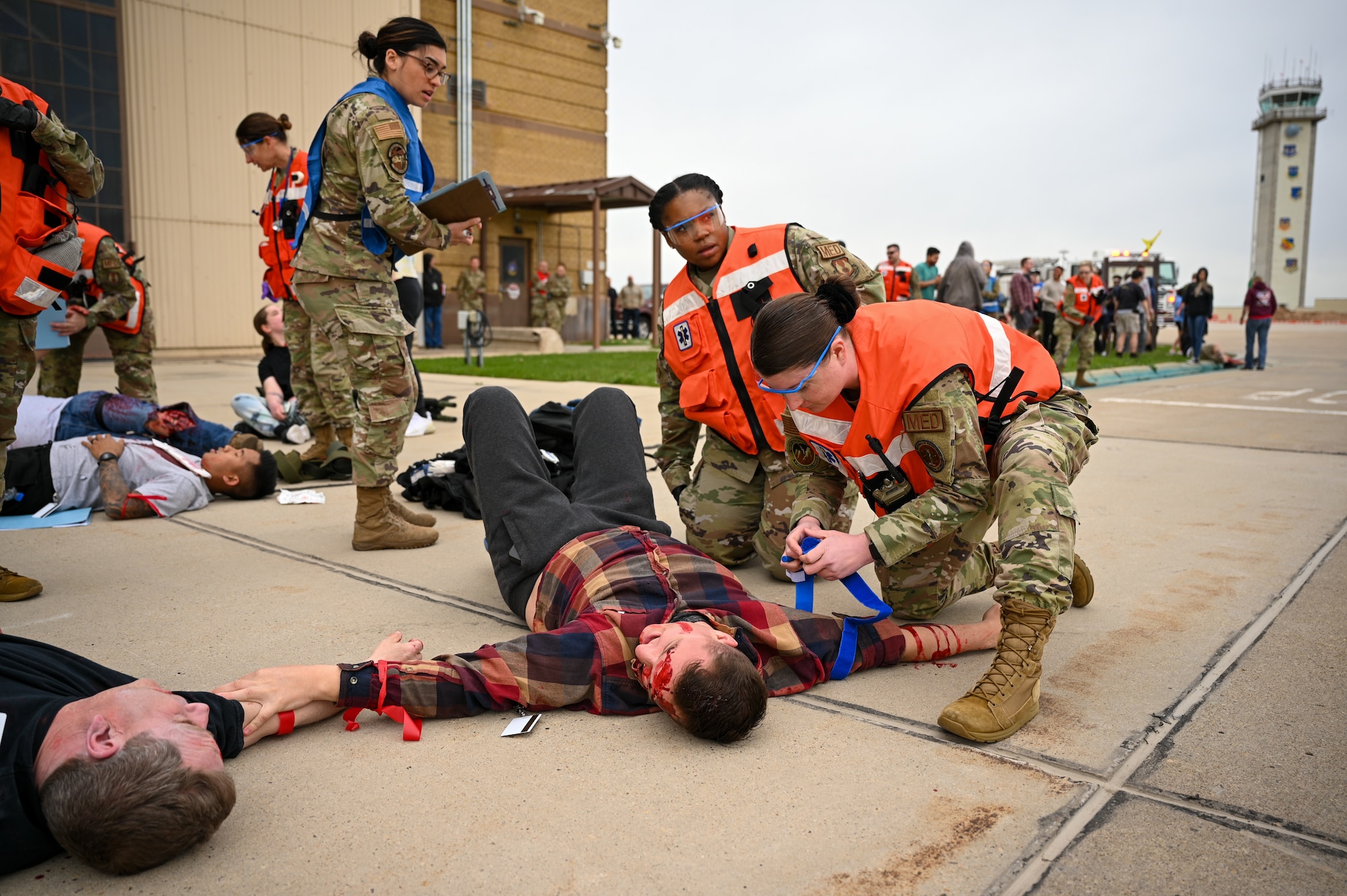 Airmen with the 75th Medical Group render aid to simulated casualties during a crash exercise at Hill Air Force Base, Utah, April 27, 2022