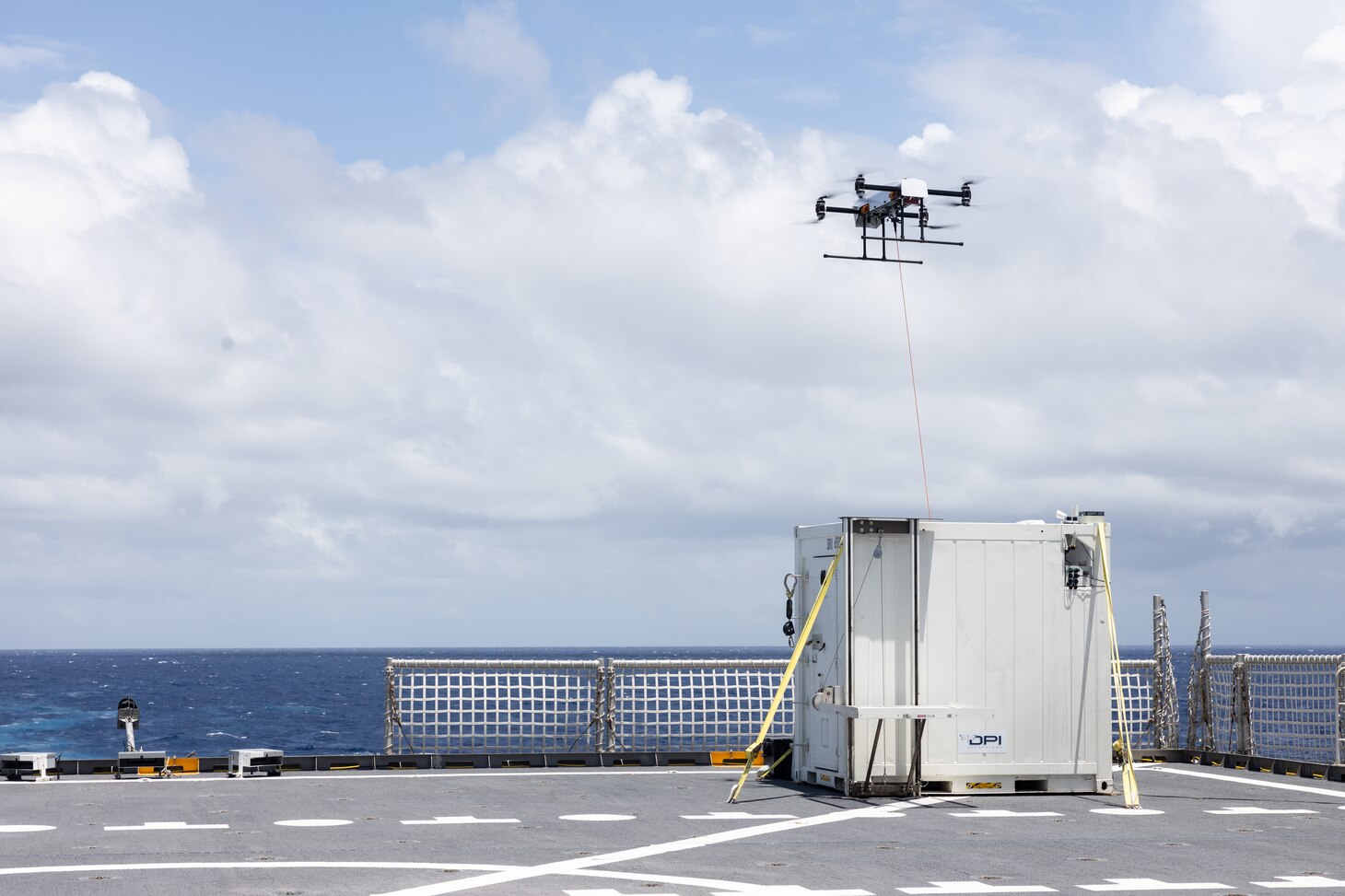 A tethered drone lands aboard the expeditionary fast transport vessel USNS Burlington (T-EPF-10) during a fleet experimentation period with scientists working with the Office of Naval Research and U.S. Naval Forces Southern Command/U.S. 4th Fleet. The fleet experimentation serves to demonstrate Navy/Marine Corps integration by testing concepts that would be employed during expeditionary advance base operations, evaluating expeditionary systems for force protection and coordinated electronic warfare.