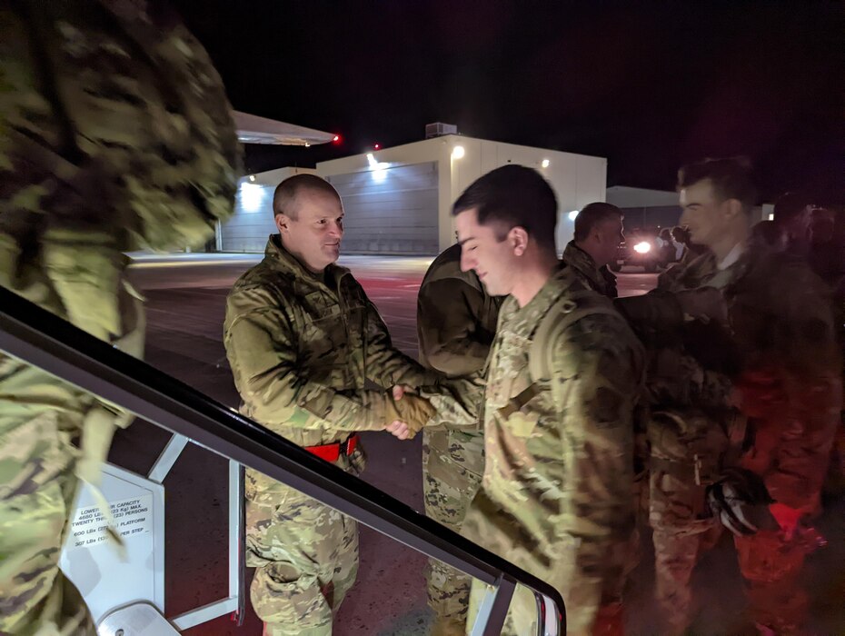Photo of U.S. Air Force Colonel David Shevchik, commander of the 158th Fighter Wing, shaking hands with members of the 158th Fighter Wing at the Vermont Air National Guard Base, South Burlington, Vermont, April 29, 2022.