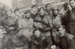 A group of men in berets and military uniforms. Black and White historical photo.