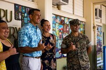 Congressman Kaiali’I Kahele, left, 2nd District of Hawaii, and U.S. Marine Corps Col. Speros Koumparakis, commanding officer, Marine Corps Base Hawaii, pose for a group photo with Mokapu Elementary School staff, MCBH, April 21, 2022. The purpose of the tour was to provide Kahele with a broader perspective on Marine Corps operations, concepts, and force design on MCBH. (U.S. Marine Corps photo by Cpl. Brandon Aultman)