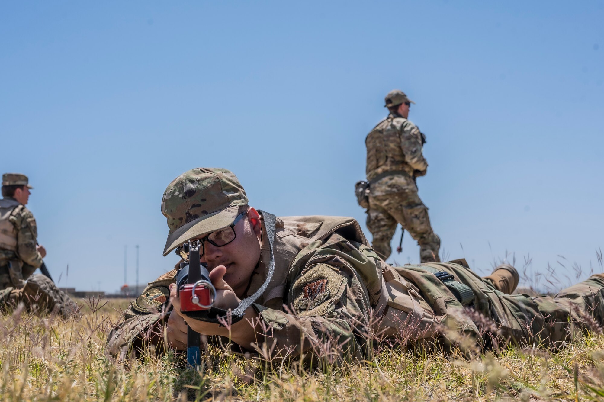 A photo of an Airman holding a gun.