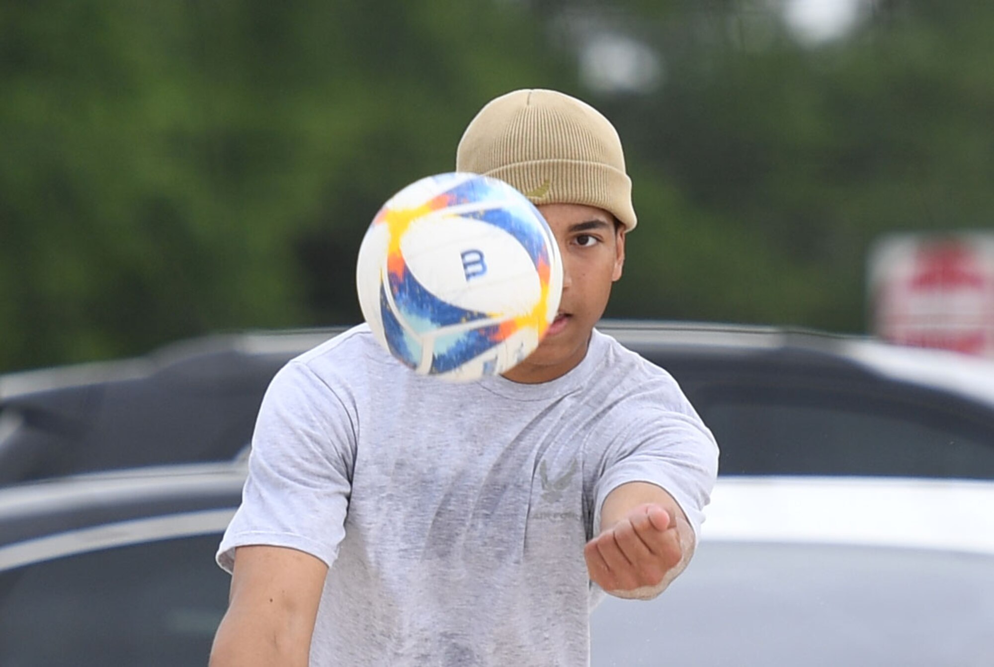 U.S. Air Force Airman Basic Chris Caughman, 338th Training Squadron student, hits a volleyball during the Sexual Assault and Awareness Prevention Month volleyball tournament at Keesler Air Force Base, Mississippi, April 29, 2022. More than 20 teams competed in the event, which was held in acknowledgment of Sexual Assault and Awareness Prevention Month throughout April. (U.S. Air Force photo by Kemberly Groue)