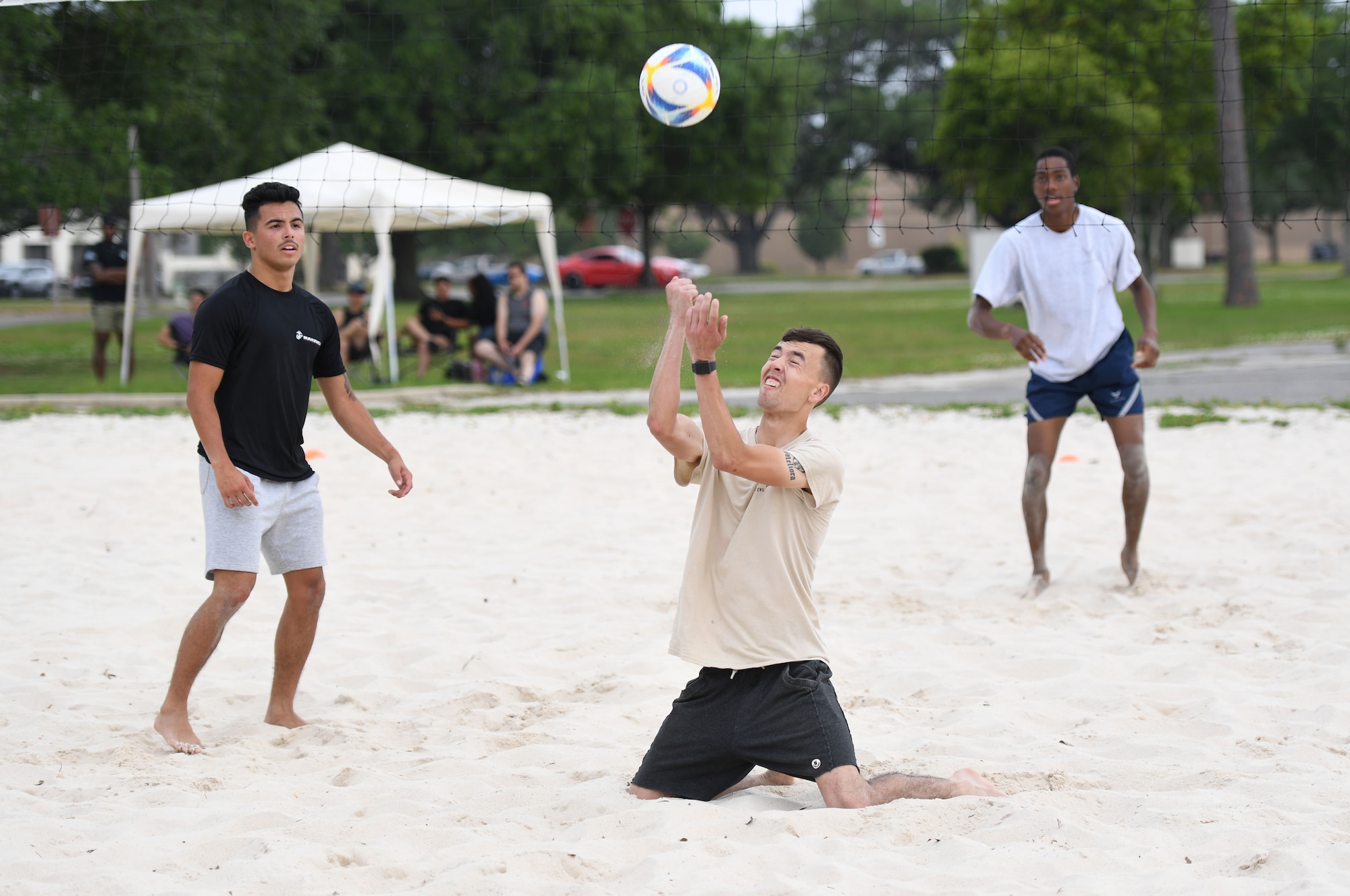 U.S. Marine Private First Class Caleb Simmons, Keesler Marine Detachment student, hits a volleyball during the Sexual Assault and Awareness Prevention Month volleyball tournament at Keesler Air Force Base, Mississippi, April 29, 2022. More than 20 teams competed in the event, which was held in acknowledgment of Sexual Assault and Awareness Prevention Month throughout April. (U.S. Air Force photo by Kemberly Groue)