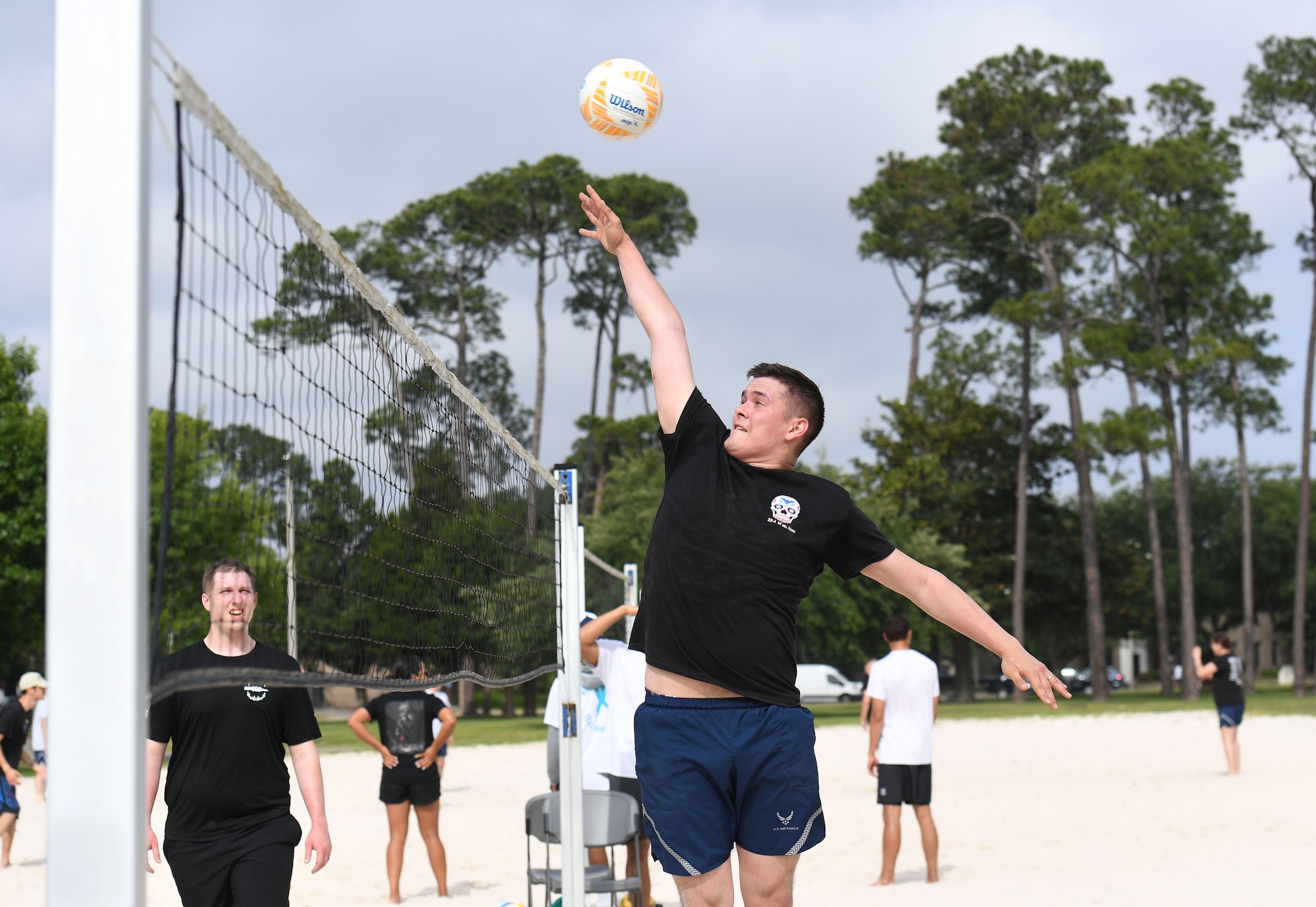 U.S. Air Force Senior Airman Jacob Pettibone, Airman Leadership School student, hits a volleyball during the Sexual Assault and Awareness Prevention Month volleyball tournament at Keesler Air Force Base, Mississippi, April 29, 2022. More than 20 teams competed in the event, which was held in acknowledgment of Sexual Assault and Awareness Prevention Month throughout April. (U.S. Air Force photo by Kemberly Groue)