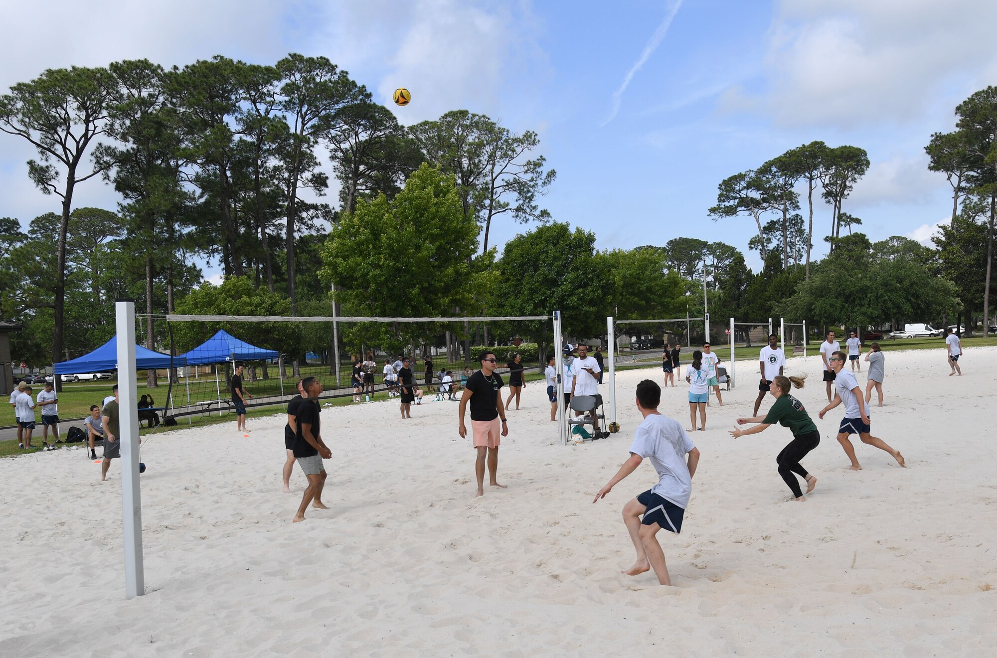 Keesler personnel participate in the Sexual Assault and Awareness Prevention Month volleyball tournament at Keesler Air Force Base, Mississippi, April 29, 2022. More than 20 teams competed in the event, which was held in acknowledgment of Sexual Assault and Awareness Prevention Month throughout April. (U.S. Air Force photo by Kemberly Groue)