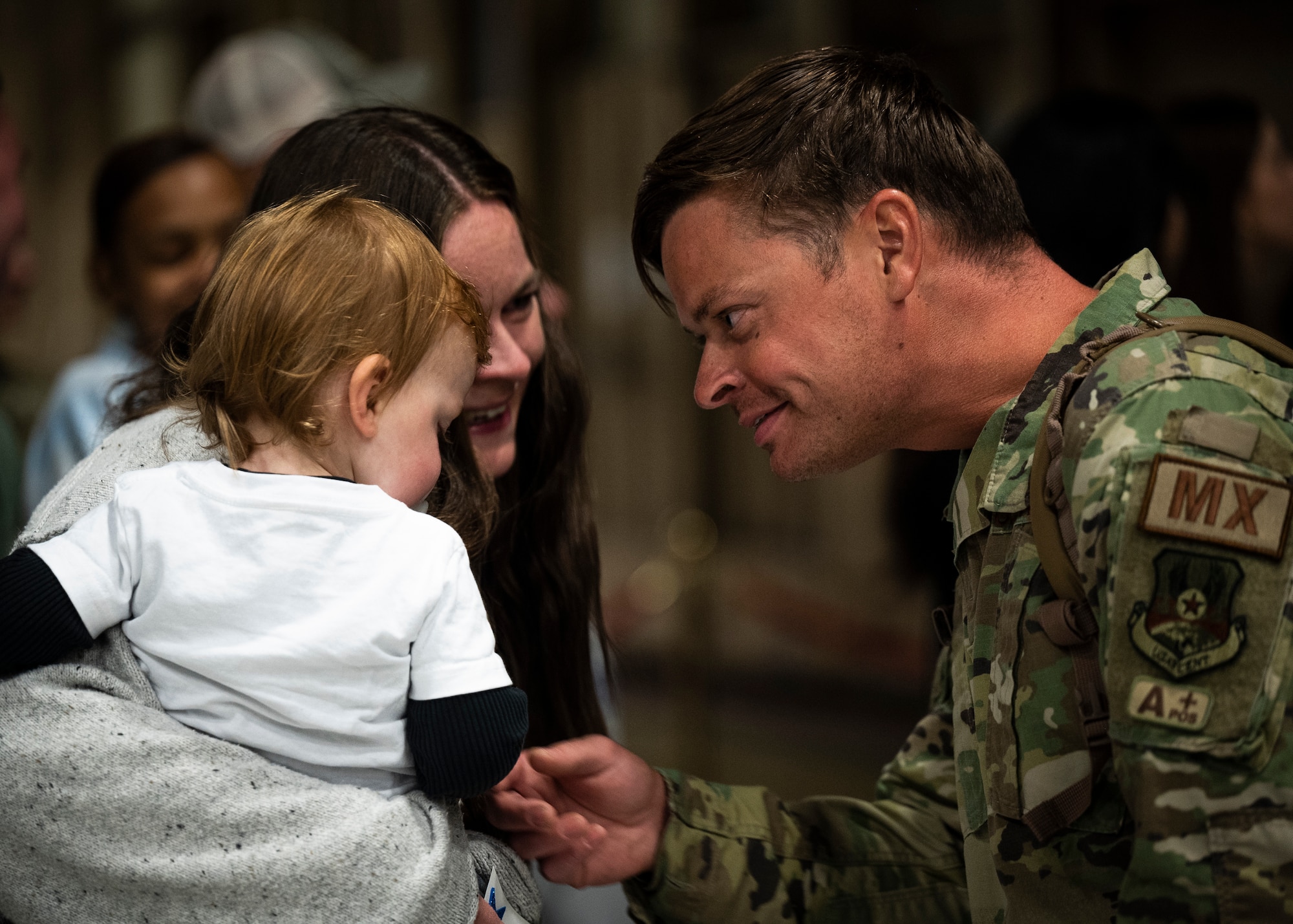 Image of friends and family reuniting after a redeployment