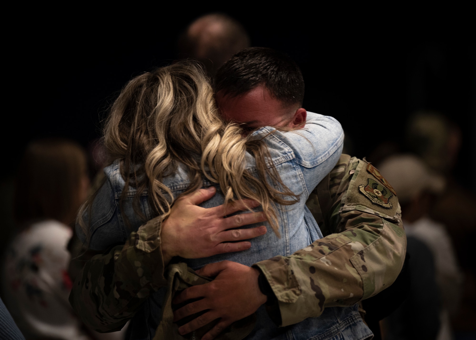 Image of friends and family reuniting after a redeployment