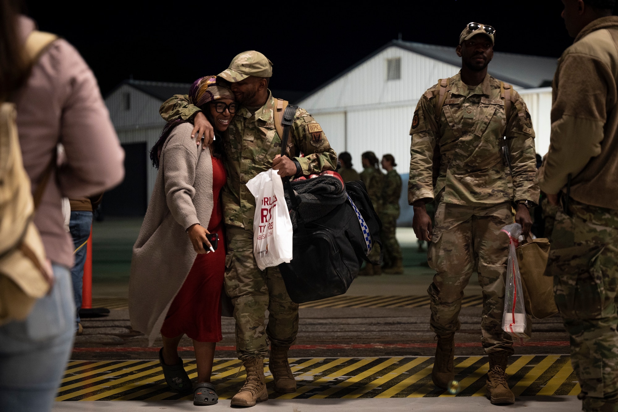 Image of friends and family reuniting after a redeployment
