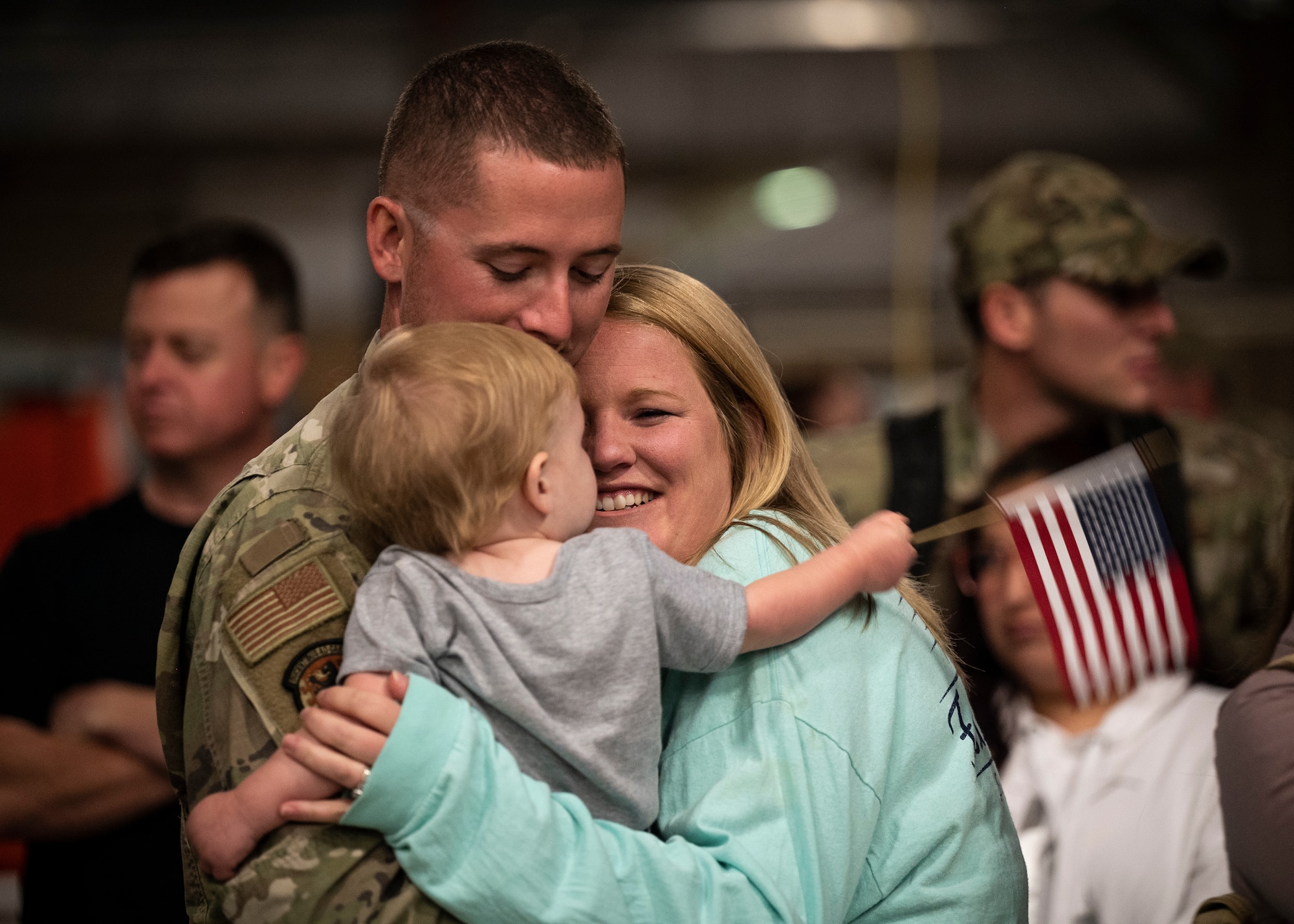 Image of family reuniting after a redeployment