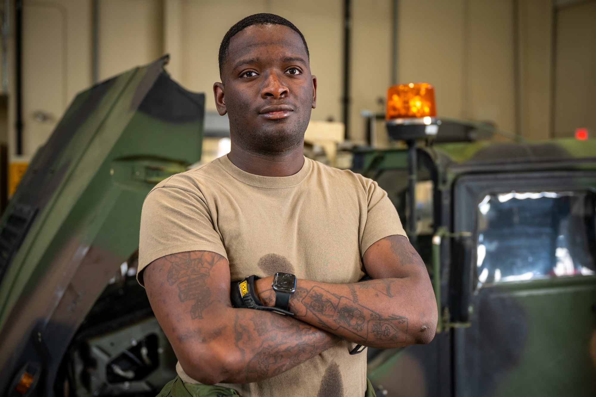 U.S. Army Specialist Darius Sims, 35th Air Defense Artillery Brigade all-wheel mechanic, poses for a photo at Osan Air Base, Republic of Korea, April 29, 2022.