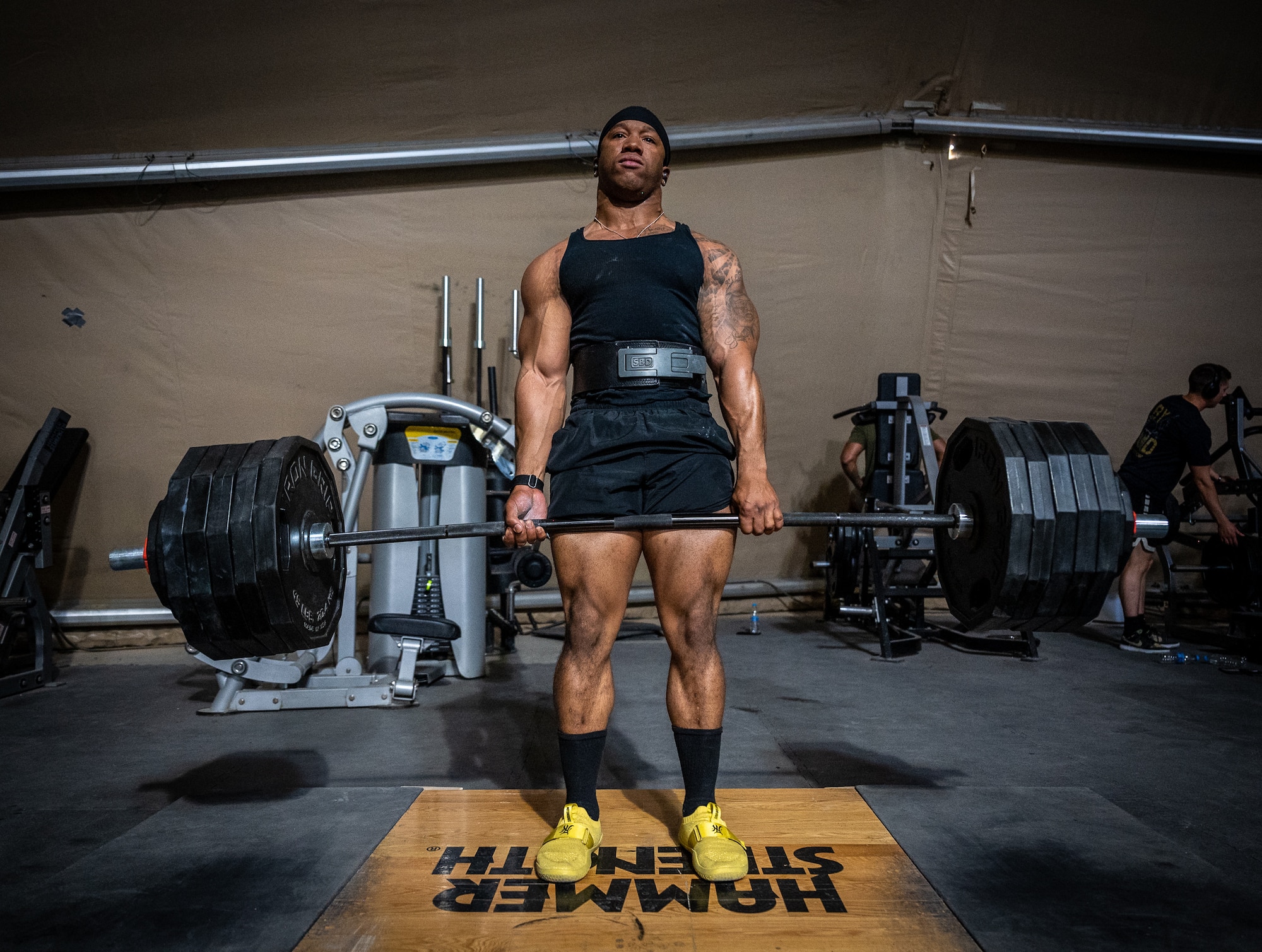 1st Lt. Anthony Bilal, 332d Expeditionary Contracting Squadron contracting officer, and construction flight commander, deadlifts 535 pounds as part of his powerlifting training routine inside the Legends Fitness Center at an undisclosed location in Southwest Asia, April 24, 2022. Bilal recently won a powerlifting competition that included the deadlift, back squat, and bench press. (U.S. Air Force photo by Master Sgt. Christopher Parr)