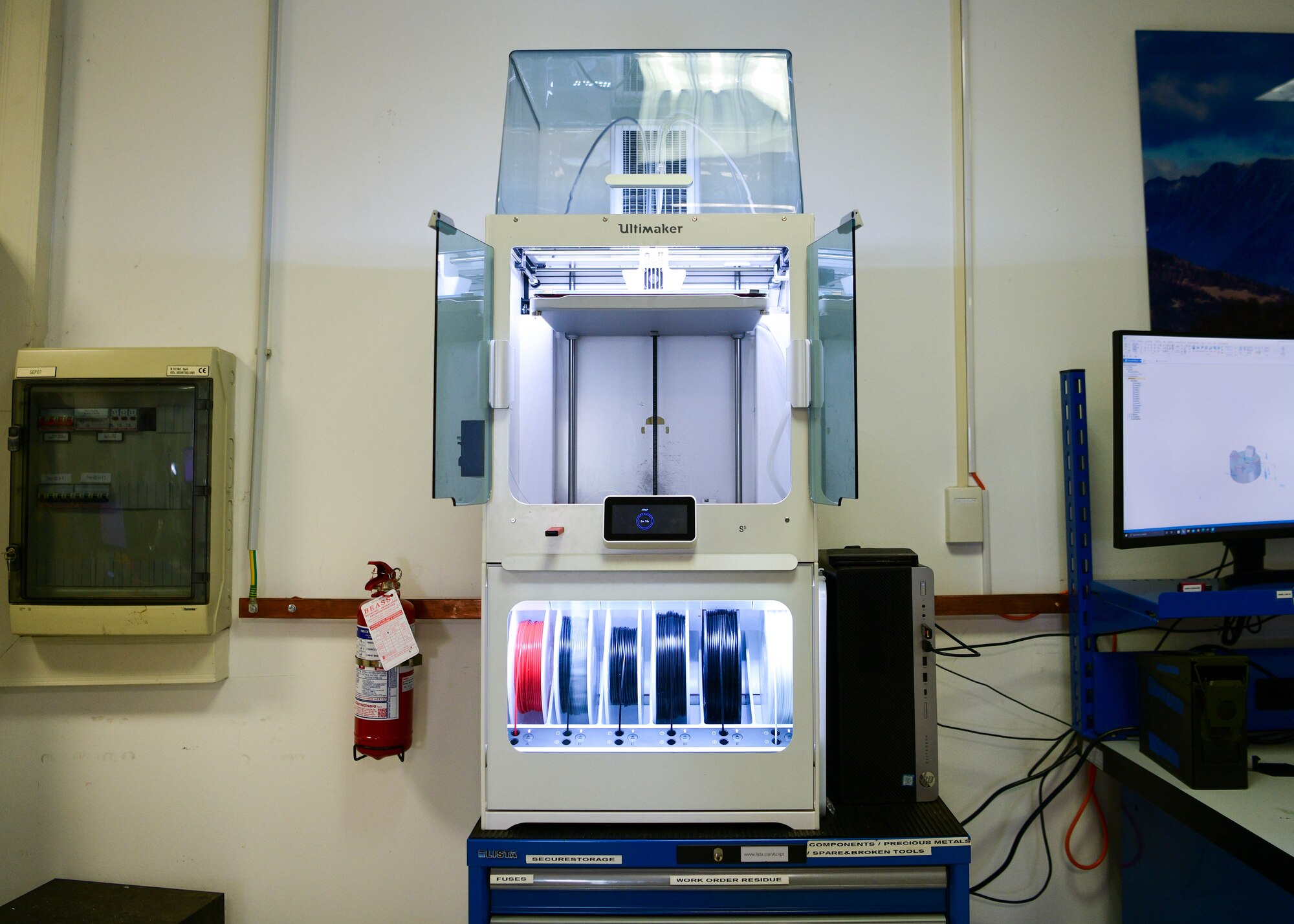 A Display Management Switch (DMS) knob for an F-16 Fighting Falcon sidestick is being 3D printed at Aviano Air Base, Italy, June 14, 2022. The F-16 Sidestick Control Grip is the main pilot and aircraft interface for flight, avionics and armament system and the DMS knob is used for avionics display manipulation and more. (U.S. Air Force photo by Senior Airman Brooke Moeder)