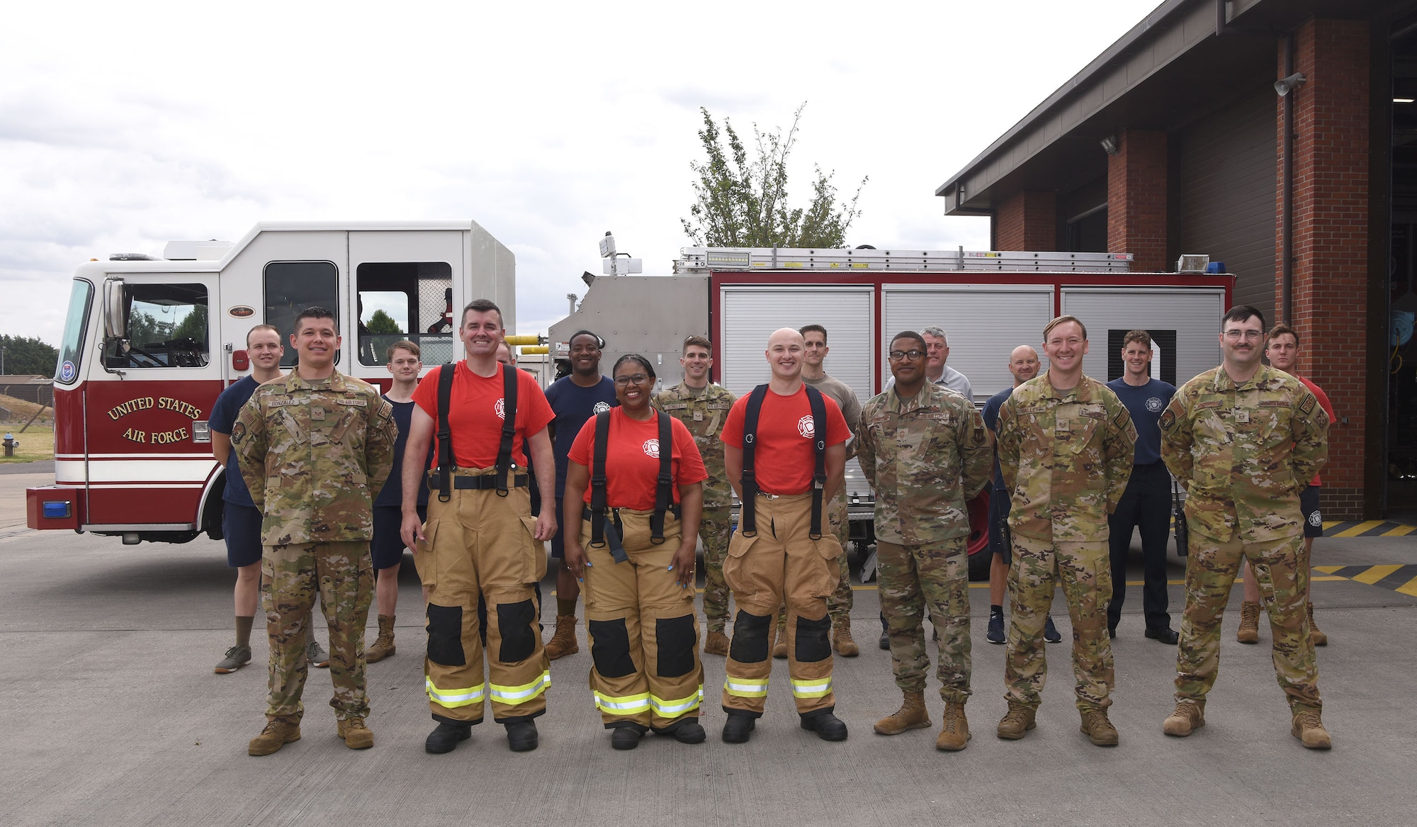 U.S. Air Force Col. Gene Jacobus, front row, second left, 100th Air Refueling Wing commander, poses for a group photo with firefighters, the installation fire chief, and commander’s support staff after getting hands-on live-fire training with the 100th Civil Engineer Squadron Fire Department at Royal Air Force Mildenhall, England, July 28, 2022. The commander spent time learning what goes on behind the scenes to protect the base and mission every day. (U.S. Air Force photo by Karen Abeyasekere)