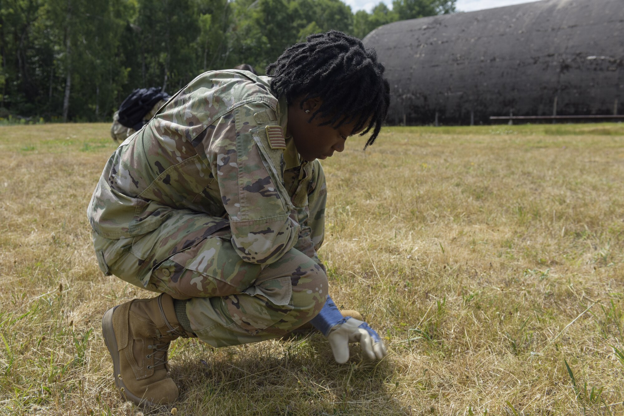 Airman searches for debris from simulated aircraft crash