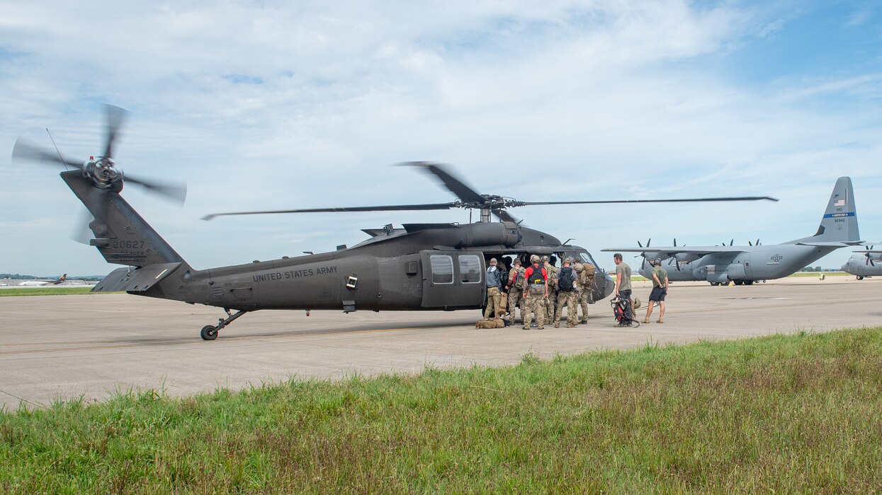 Airmen from the Kentucky Air National Guard’s 123rd Special Tactics Squadron load a UH-60 Blackhawk Helicopter with lifesaving equipment at the Kentucky Air National Guard Base in Louisville, Ky., July 30, 2022. In response to flooding in Eastern Kentucky, the unit coordinated 29 rotary-wing relief missions, rescued 19 people and two dogs, and recovered four bodies. Their command-and-control efforts also facilitated the assistance or recovery of 40 people. (U.S. Air National Guard photo by Staff Sgt. Clayton Wear)
