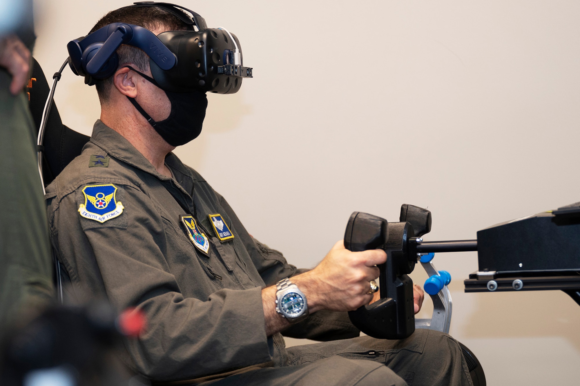 An Airman flies a VR trainer